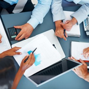 Cropped image of hands of businesspeople working together on business project at office - Consulting